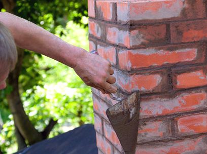 Trowel making a pointing pass along a stack face